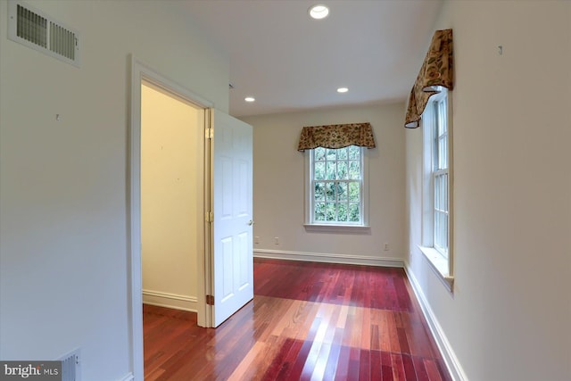 corridor with dark wood-type flooring