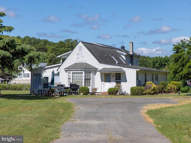 view of front of home with a front yard