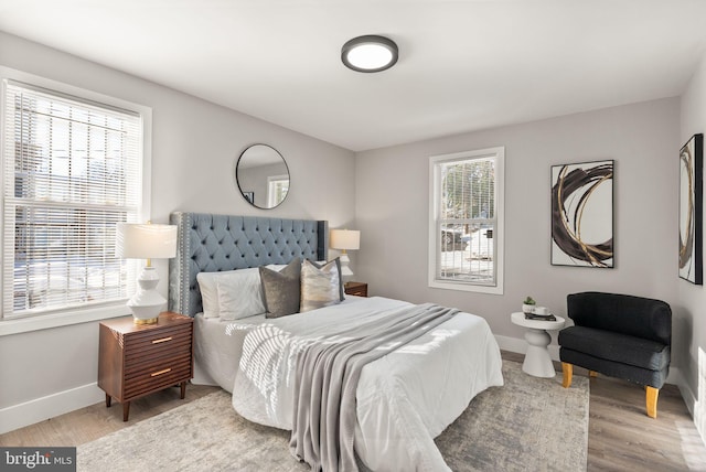 bedroom with light wood-type flooring