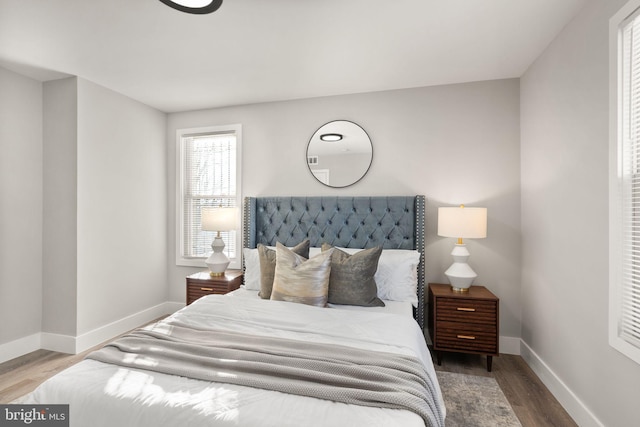 bedroom with wood-type flooring