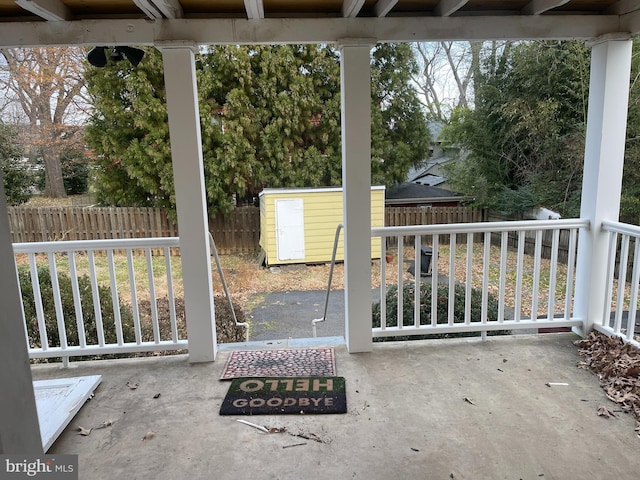 view of patio / terrace with a storage shed