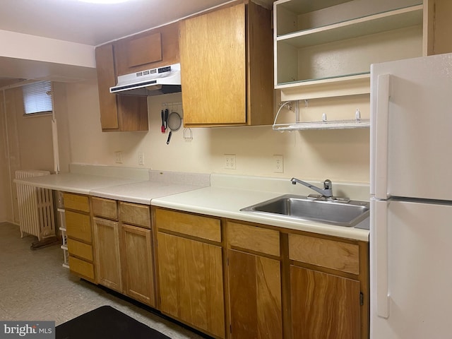 kitchen with white fridge and sink