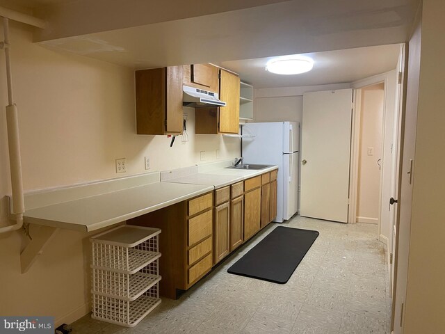 kitchen with white refrigerator and sink