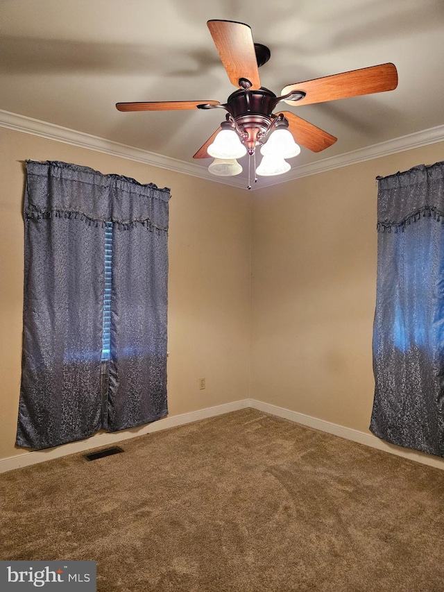 carpeted empty room featuring ornamental molding and ceiling fan