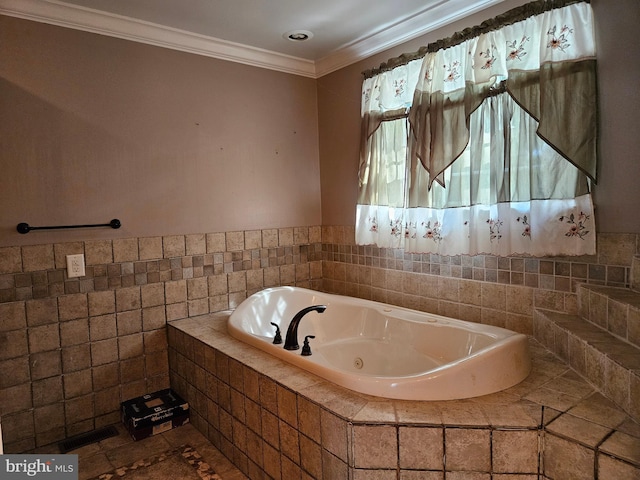 bathroom featuring ornamental molding, tile walls, and tiled tub