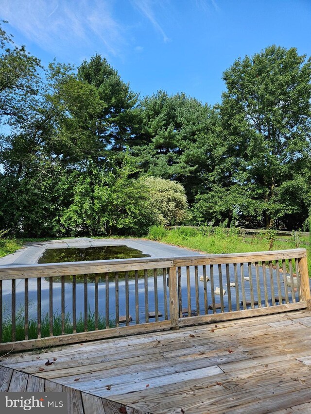 wooden terrace with a water view