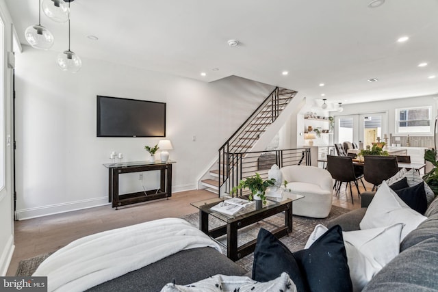 living room with french doors and hardwood / wood-style floors