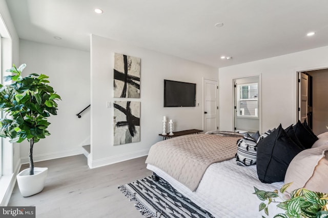 bedroom with light wood-type flooring