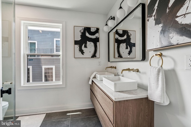 bathroom with tile patterned floors, vanity, and toilet