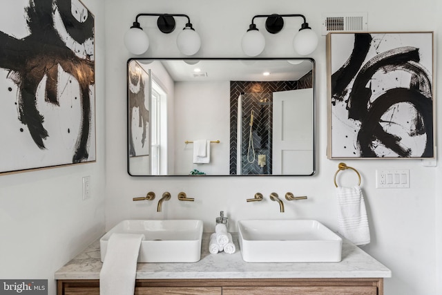 bathroom with dual bowl vanity