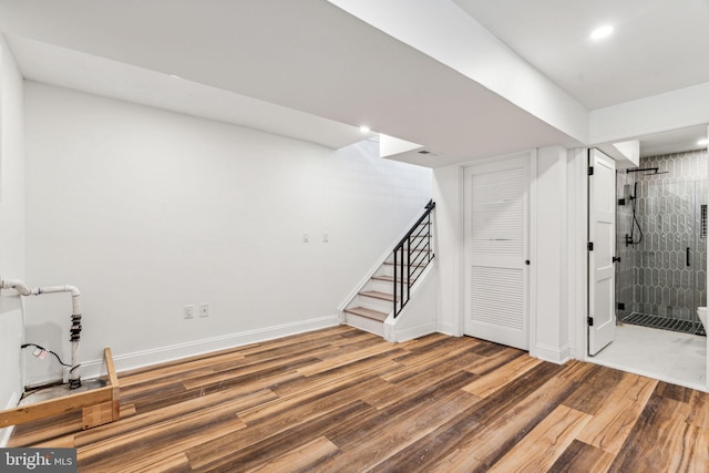 basement featuring hardwood / wood-style flooring