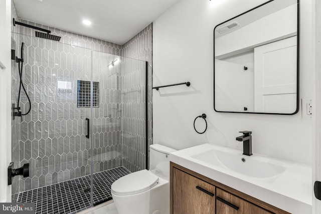 bathroom with vanity, toilet, and walk in shower