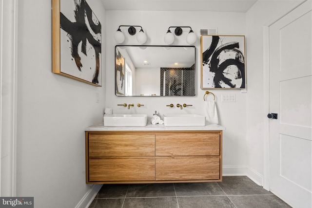 bathroom featuring tile patterned flooring and dual vanity