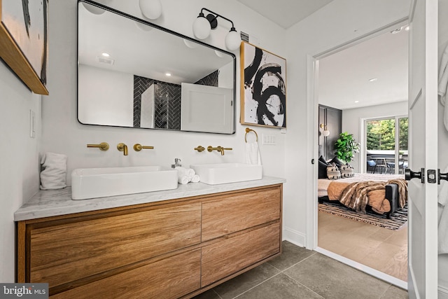 bathroom with tile patterned floors and vanity