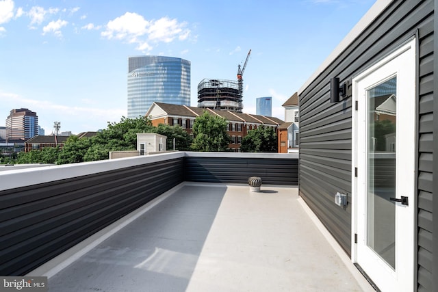 view of patio featuring a balcony