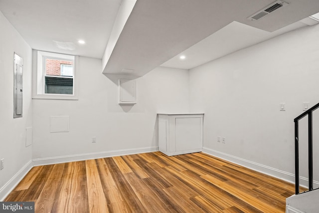 basement featuring hardwood / wood-style floors