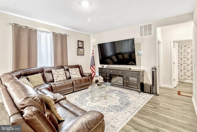 living room featuring light wood-type flooring