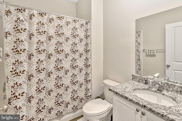 full bathroom featuring vanity, toilet, and shower / bathtub combination with curtain