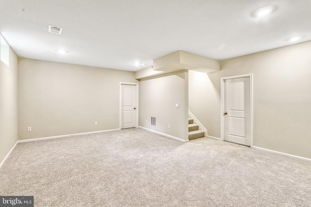 basement with light colored carpet