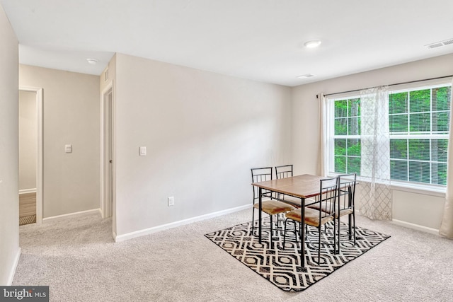 view of carpeted dining space