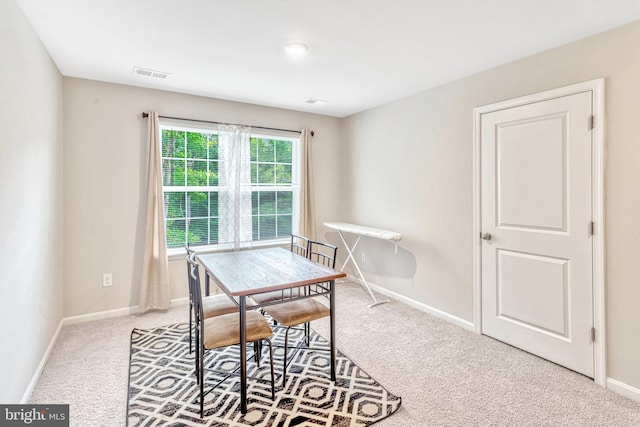 view of carpeted dining space