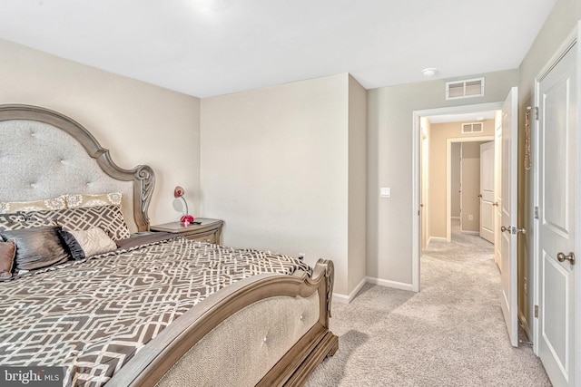 bedroom featuring light carpet