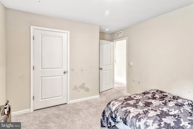 bedroom with light carpet