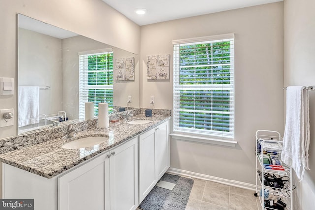 bathroom with tile patterned flooring and vanity