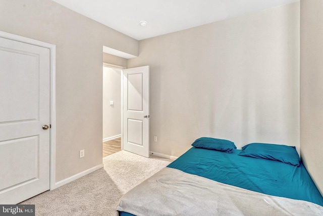 bedroom with light colored carpet