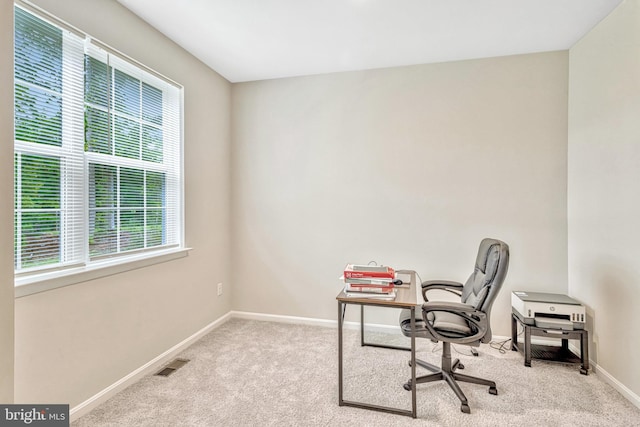 home office with light carpet