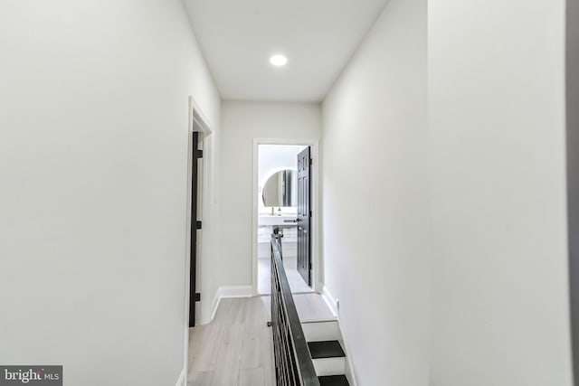 hall with light hardwood / wood-style floors