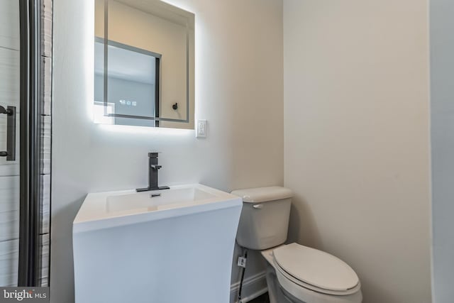 bathroom with sink and toilet