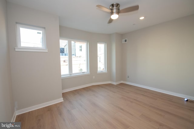 spare room with ceiling fan and light hardwood / wood-style floors