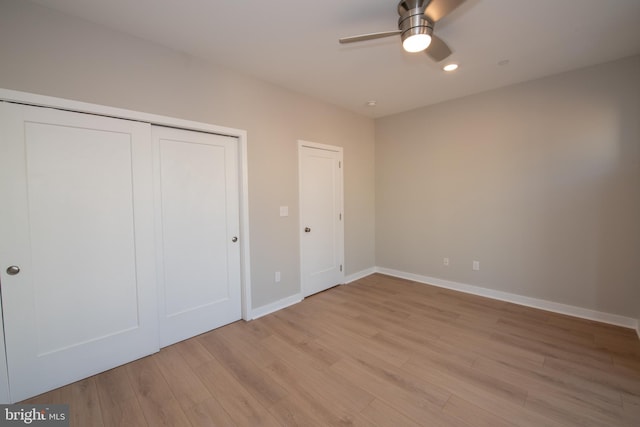 unfurnished bedroom featuring ceiling fan and light hardwood / wood-style floors