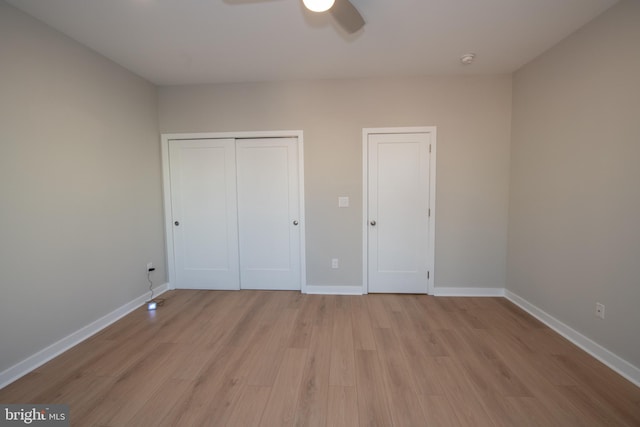 unfurnished bedroom with light wood-type flooring and ceiling fan