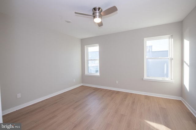 unfurnished room featuring ceiling fan and light hardwood / wood-style flooring