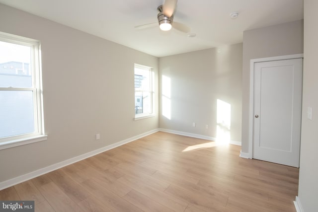 spare room featuring ceiling fan and light wood-type flooring