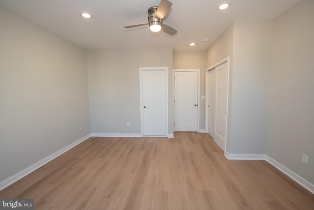 unfurnished bedroom with light hardwood / wood-style flooring and ceiling fan