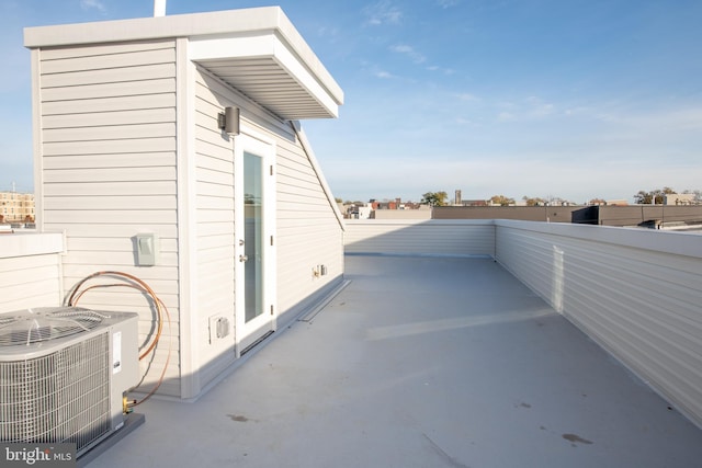 view of patio / terrace with a balcony and central AC unit