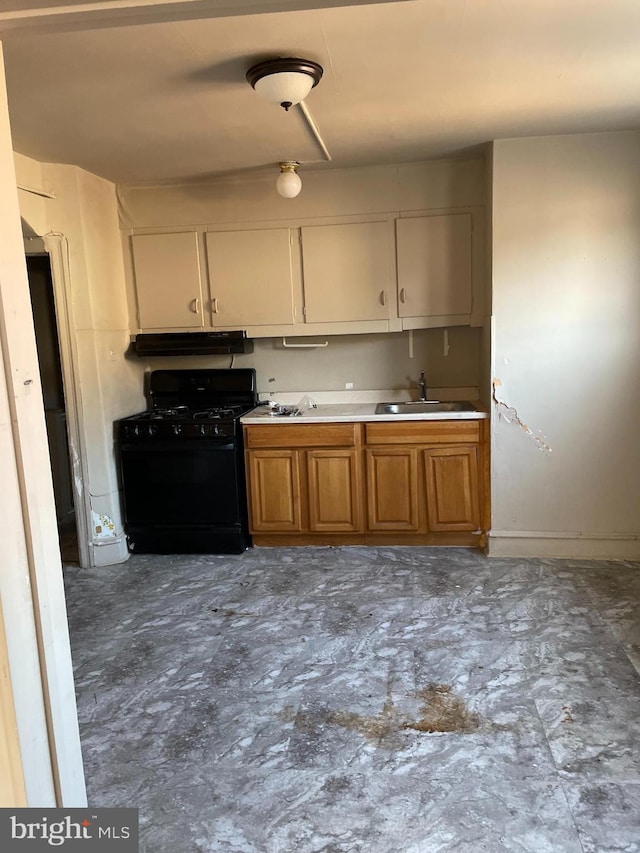 kitchen with black gas stove and sink