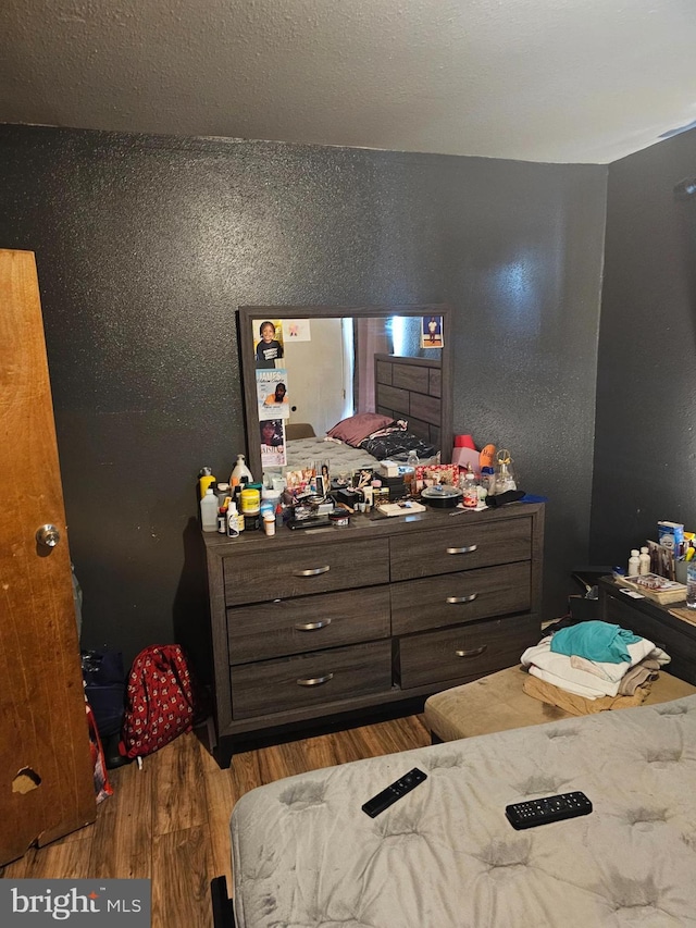 bedroom with light wood-type flooring