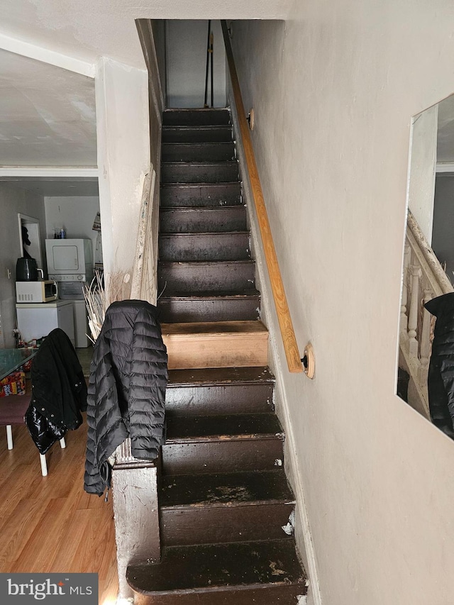 staircase featuring hardwood / wood-style flooring