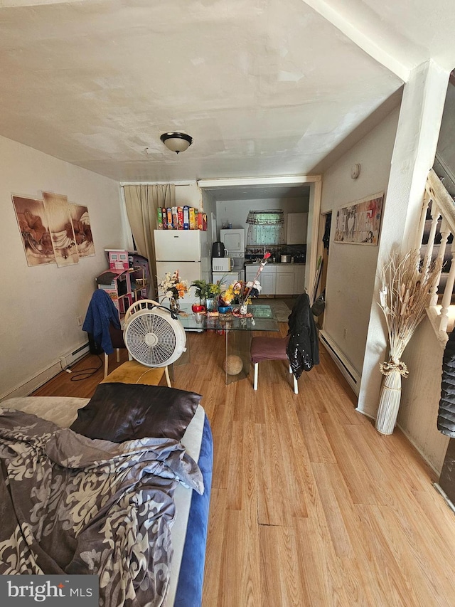 interior space featuring light hardwood / wood-style flooring and a baseboard heating unit