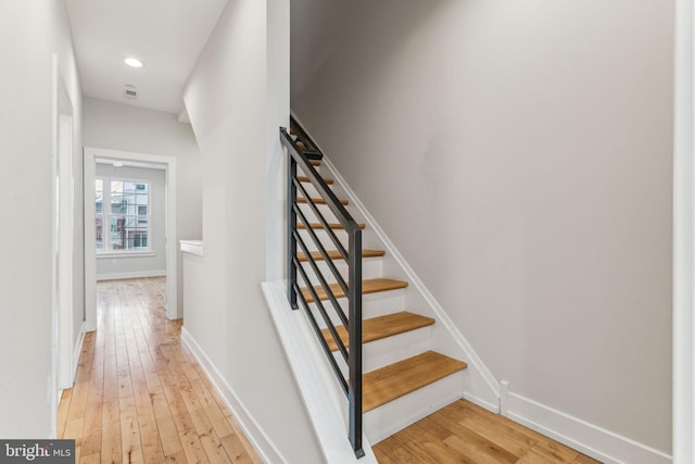 staircase featuring hardwood / wood-style flooring