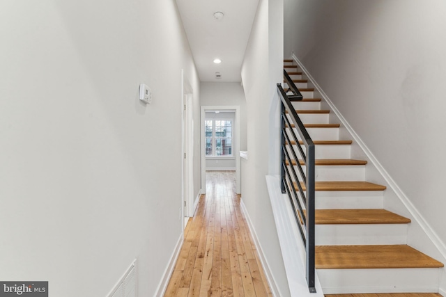 staircase featuring hardwood / wood-style flooring