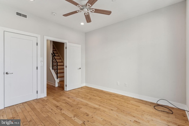 unfurnished bedroom featuring ceiling fan and light hardwood / wood-style flooring