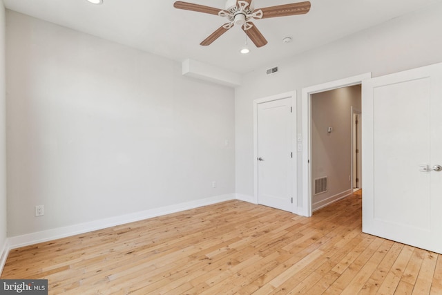 spare room featuring ceiling fan and light wood-type flooring