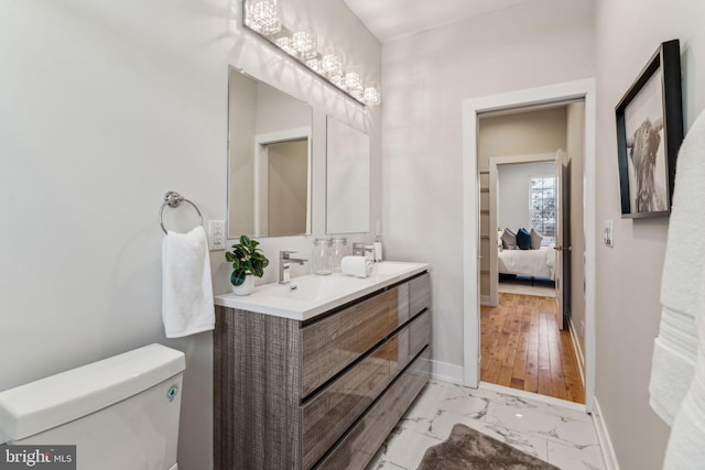 bathroom featuring toilet and vanity