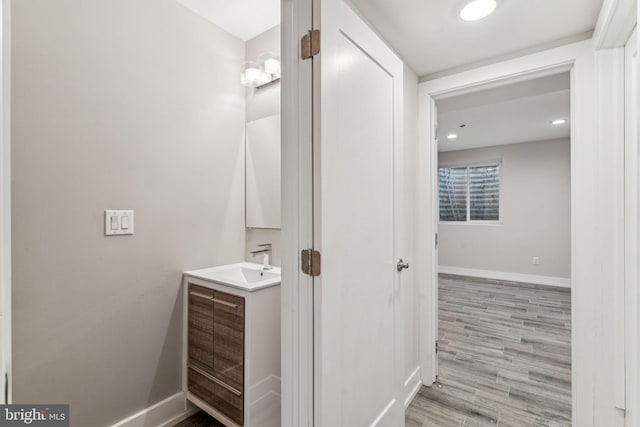 bathroom featuring vanity and hardwood / wood-style floors