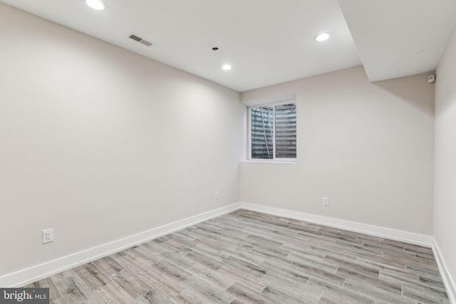 unfurnished room with light hardwood / wood-style flooring